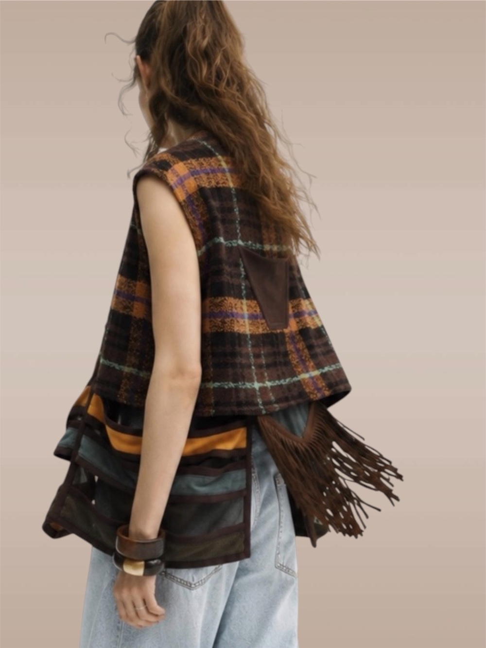 The Louqii Exceptional Quality Nomad Vest with Plaid Fringe and cutout design